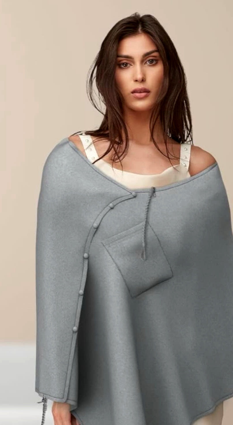 Woman wearing the Lovelyz grey nursing poncho